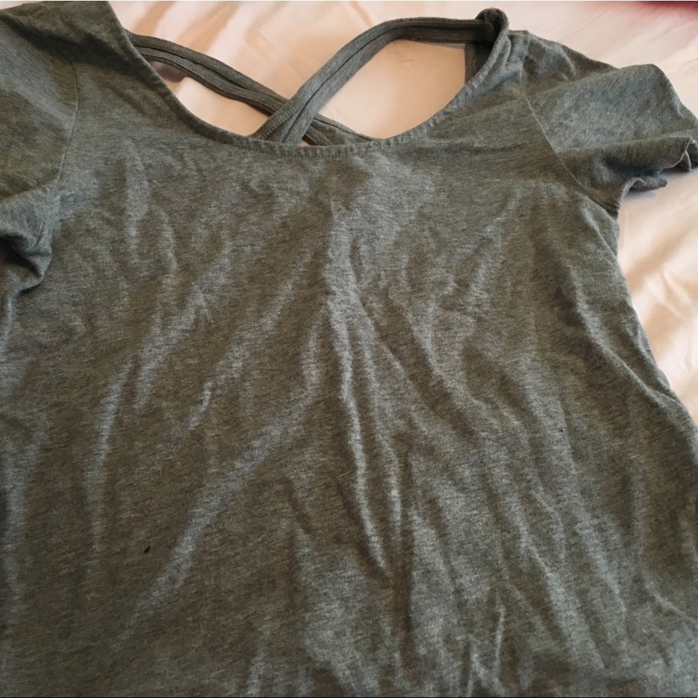grey shirt w cut out design in back